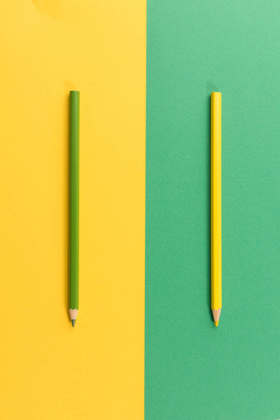 Colored pencils on color paper background - Фото, изображение