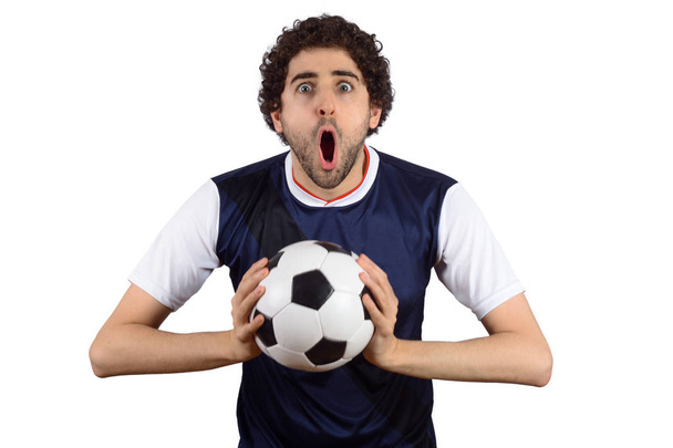 Young man in soccer football uniform screaming while his team wi - Zdjęcie, obraz