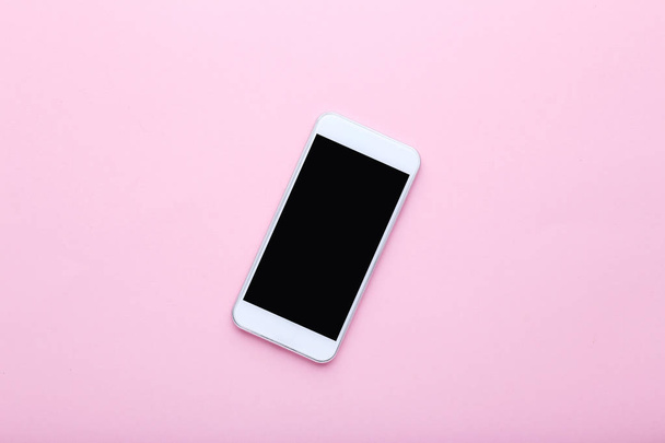 Смартфон на розовом фоне
 - Фото, изображение