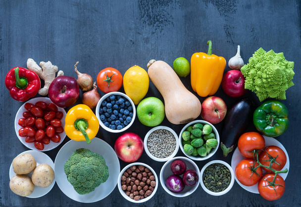 Healthy eating ingredients: fresh vegetables, fruits and superfood. Nutrition, diet, vegan food concept. Concrete background - Zdjęcie, obraz