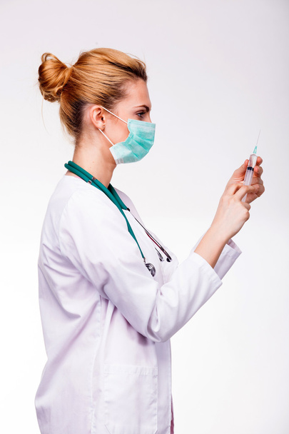 medic preparing a syringe - Fotó, kép