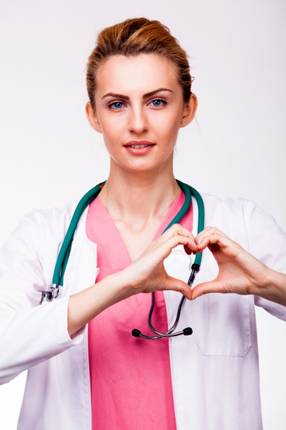 doctor showing heart sign - Fotó, kép