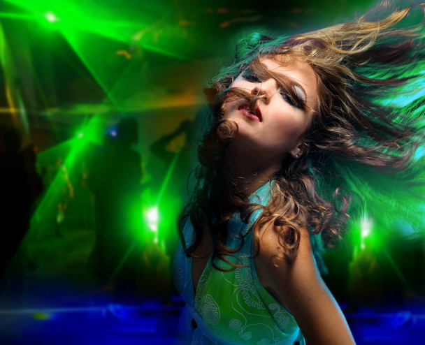 Beautiful young woman dancing in the nightclub - Photo, Image