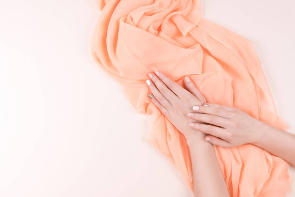 Manicure and textile background. - 写真・画像