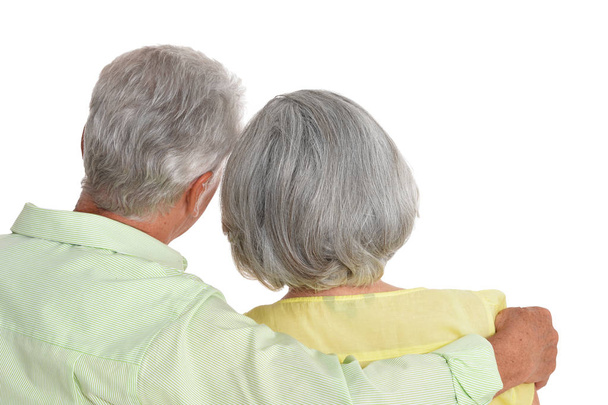 rear view of  senior couple hugging  isolated on white background  - Valokuva, kuva