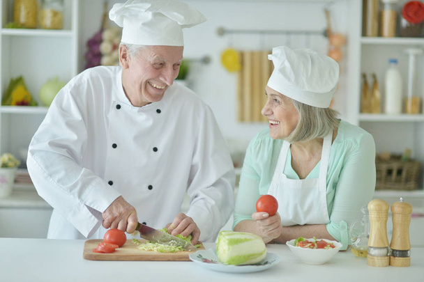 Senior couple at kitchen  - Valokuva, kuva