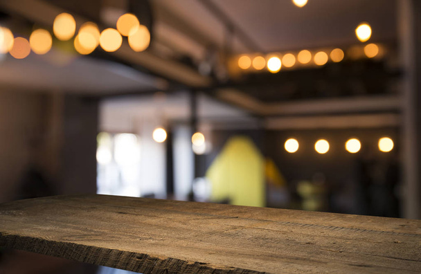 blurred background of bar and dark brown desk space of retro wood - Foto, afbeelding