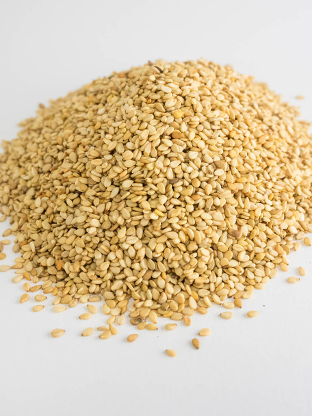 Mountain of sesame seeds on white background - Photo, Image