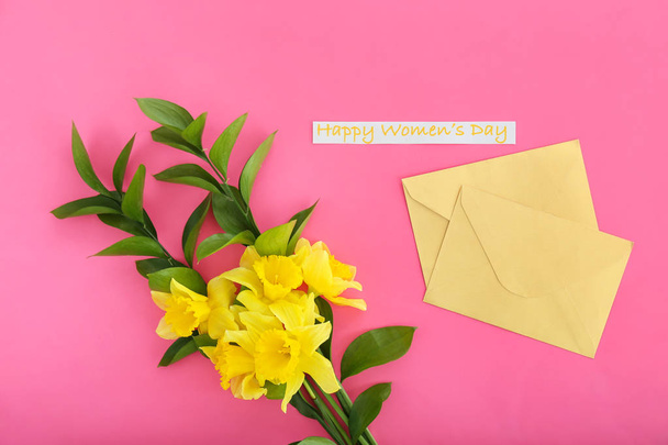 Envelopes with beautiful flowers for International Women's Day on color background - Foto, afbeelding
