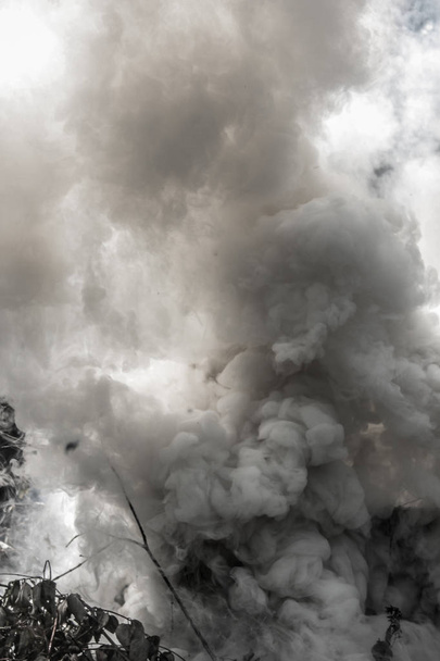 thick smoke from the fire rises - Fotó, kép