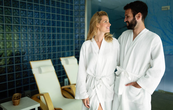 Attractive happy couple relaxing in spa center together - Foto, immagini