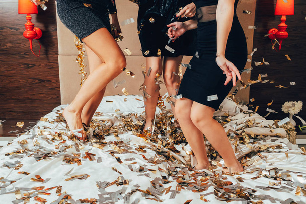 party females fun joy confetti women black - Foto, Bild