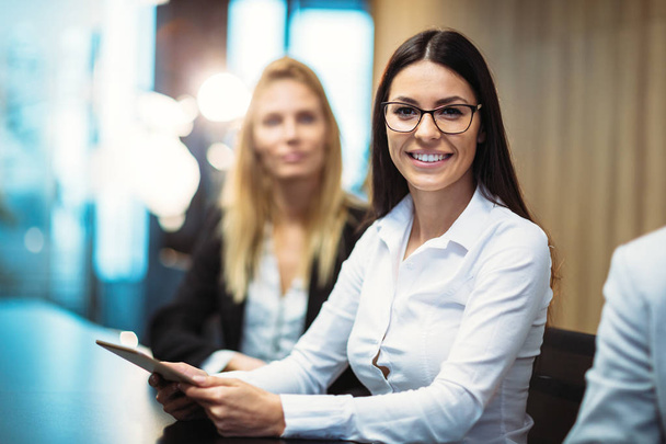 Picture of attractive smiling businesswoman in conference room - Φωτογραφία, εικόνα