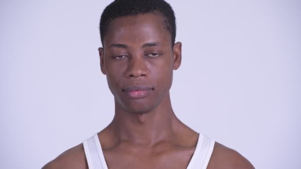 Face of young stressed African man looking sad and depressed - Video, Çekim