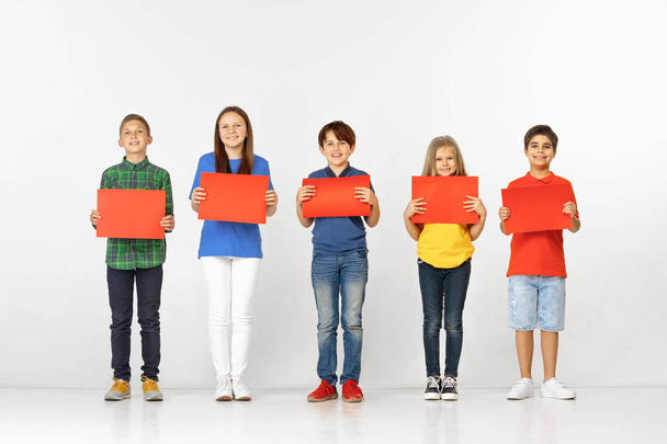 Group of children with red banners isolated in white - Fotoğraf, Görsel