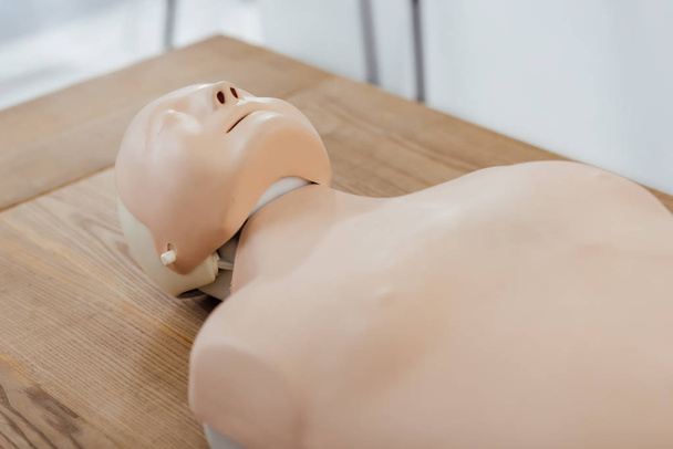 cpr dummy for first aid training on wooden table  - Photo, Image