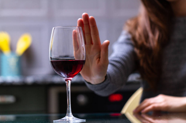 Woman refuses to drink a alcohol. Female alcoholism concept. Treatment of alcohol addiction. Quit booze and alcoholism. - Foto, Imagem