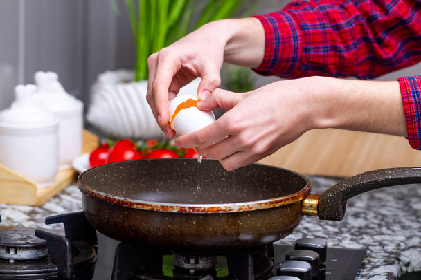 Frying homemade, chicken eggs in the frying pan for a healthy  breakfast. Protein food  - Fotoğraf, Görsel