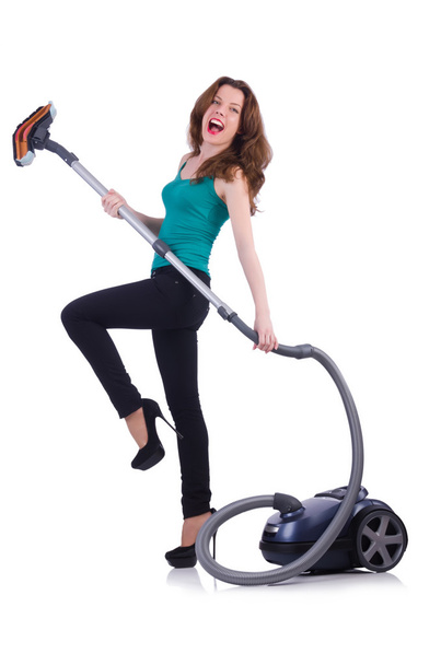 Young woman with vacuum cleaner on white - Fotó, kép