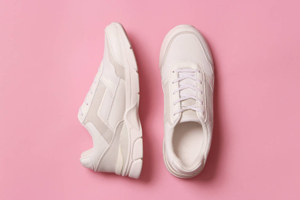 women's sneakers on a colored background. Women's shoes. - Foto, Imagen