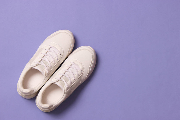 women's sneakers on a colored background. Women's shoes. - Foto, Imagem