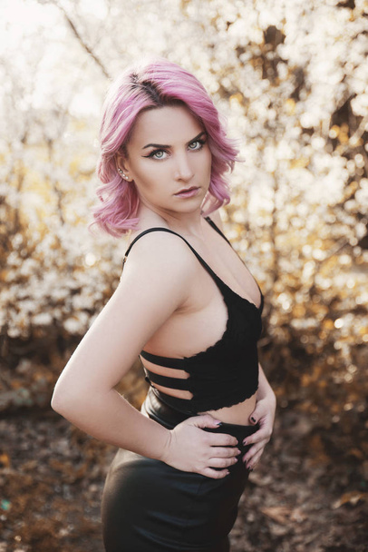 Portrait of beautiful woman with dyed pink hair - Foto, imagen