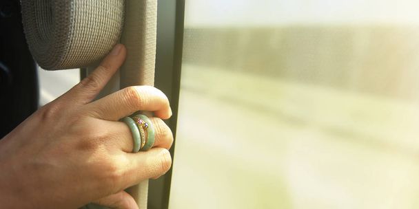 hand on the window of the bus - Photo, Image