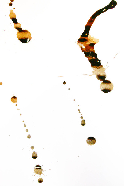 Taches d'encre de couleur Sepia sur une feuille de papier blanc
 - Photo, image