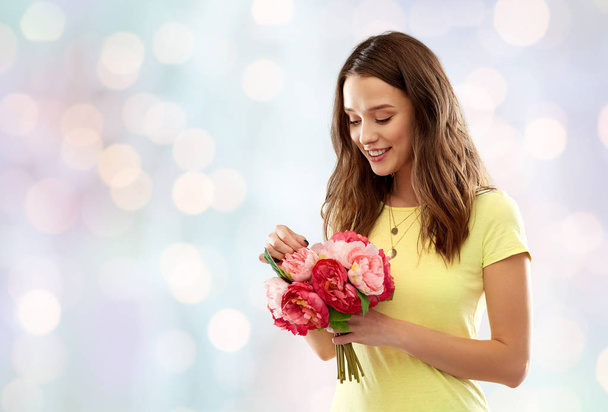 young woman or teenage girl with flower bouquet - Zdjęcie, obraz