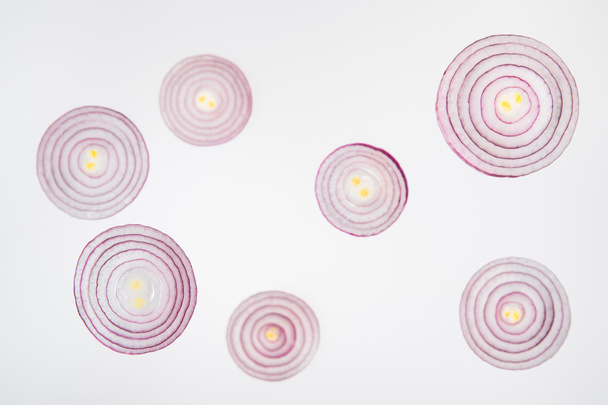 fresh ripe sliced red onions on grey background - Photo, Image