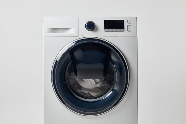 Moderní pračka s černou displejí izolovaná na šedé - Fotografie, Obrázek