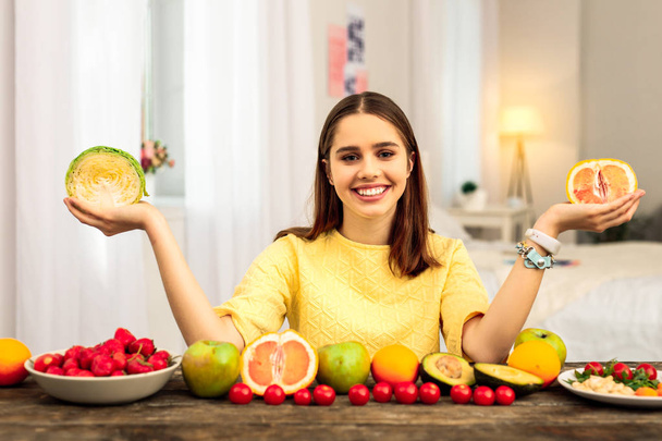 Woman eating healthy fruit while being on a diet - Fotó, kép