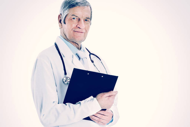 Adult experienced doctor with a folder and a stethoscope. Isolated on white background. - Фото, зображення