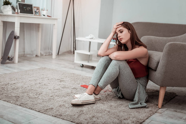 Teenager girl feeling upset while staying at home - Фото, зображення