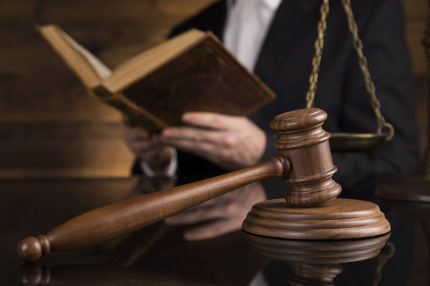 Judge, male judge in a courtroom striking the gavel - Фото, зображення