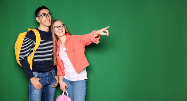 Cheerful teenagers on color background, space for text. Youth lifestyle and friendship - Fotoğraf, Görsel