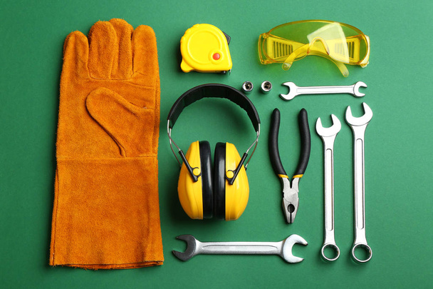 Flat lay composition with different construction tools on color background - Foto, Imagen