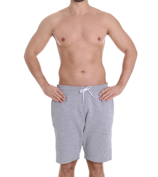 Young man on white background, closeup. Weight loss - Foto, immagini