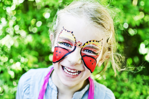 Girl with painted face - Foto, imagen