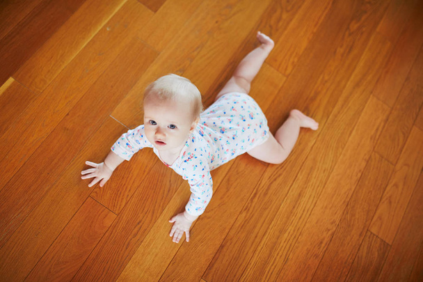 Baby girl learning to crawl - Fotó, kép