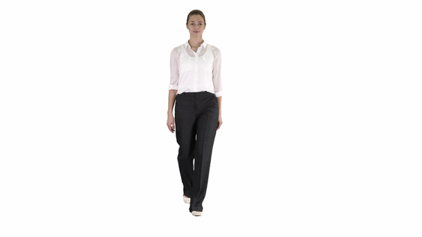 Woman walking in formal outfit on white background. - Footage, Video