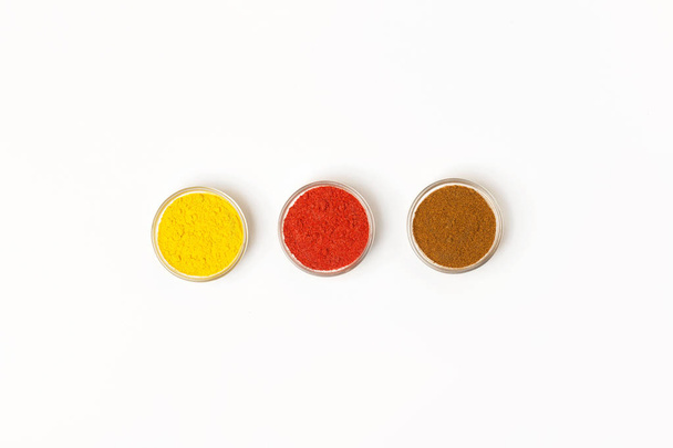Condiments and herbs on white background. Flat lay. Top view. - Foto, Bild