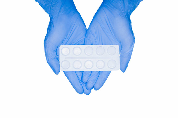holding pill capsule drugs in hand latex glove white background. medicine for various diseases hospital concept. - Foto, Imagen