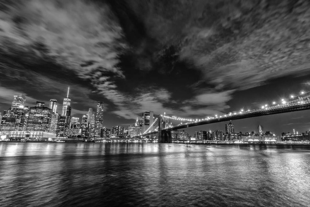 Skyline of Manhattan and Brooklyn bridge, night view. - Photo, Image