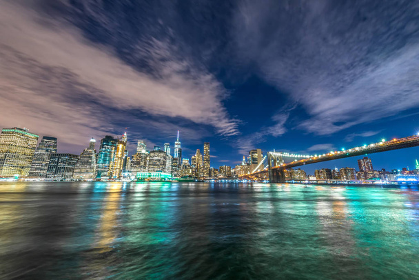 Skyline of Manhattan and Brooklyn bridge, night view. - Photo, Image