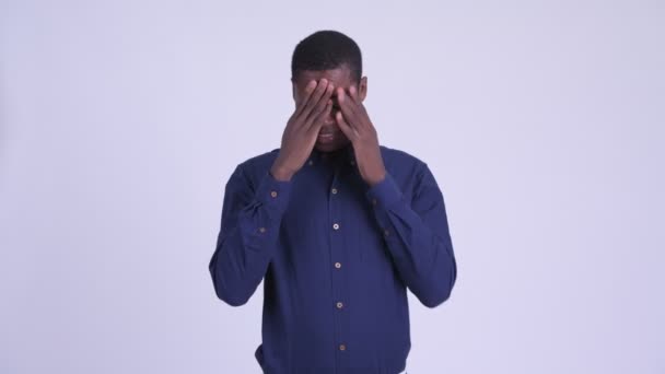 Young stressed African businessman having headache - 映像、動画