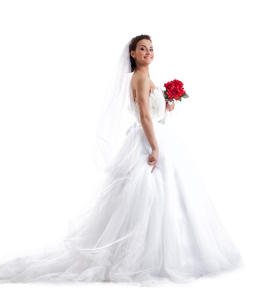 Elegante sposa sorridente in posa con bouquet rosso
 - Foto, immagini
