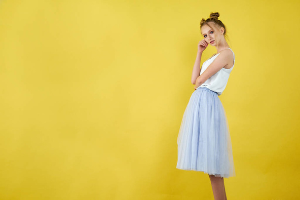 young girl on a yellow bright background. beautiful makeup, bright image, place for text - Photo, Image
