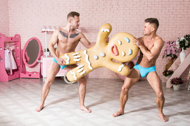 Fight for gingerbread. Two funny guys. - Photo, Image