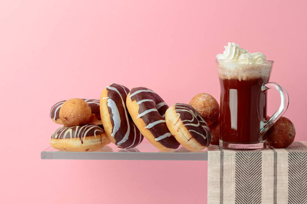 Chocolate donuts and hot chocolate with cream. - Foto, imagen